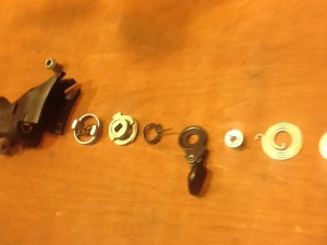 Three springs, multiple washers, levers, gears, shifter, brake lever, back and forth, tick the tock for 3 speeds or 11.